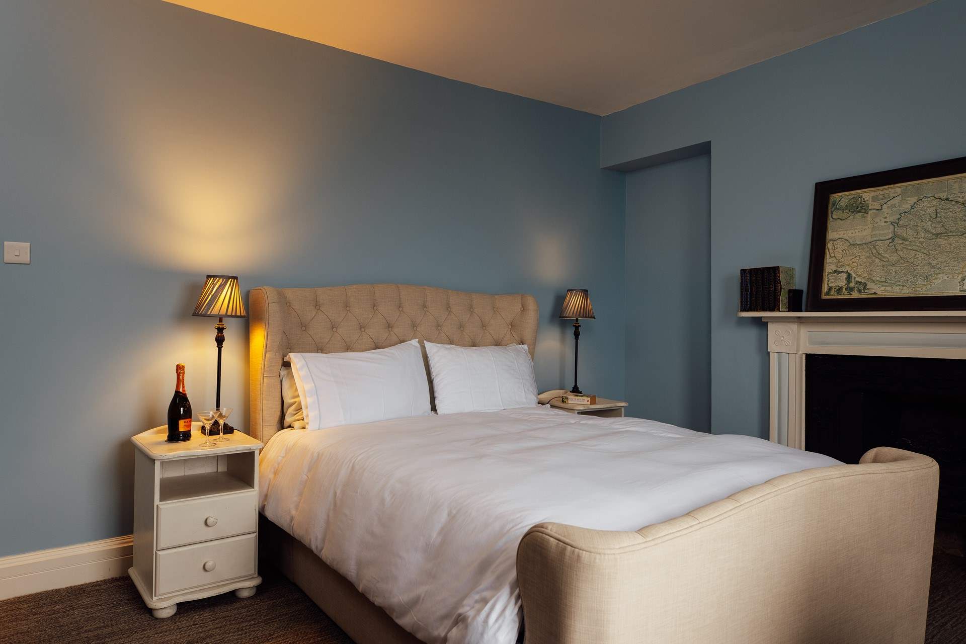 Ornate original fireplaces adorn the three bedrooms. 