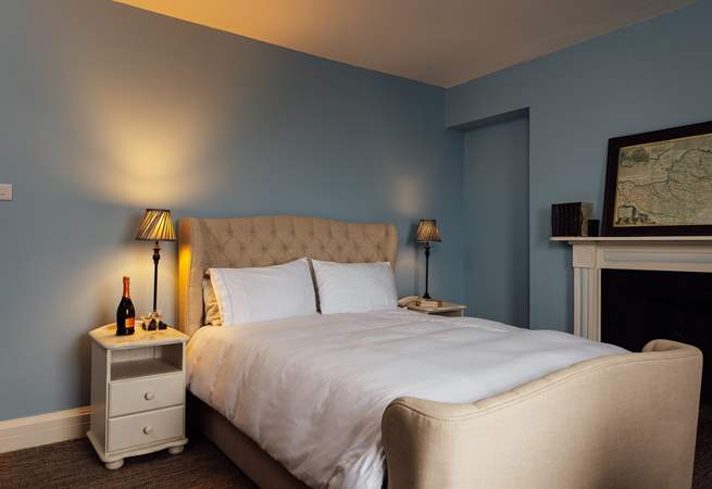 Ornate original fireplaces adorn the three bedrooms. 