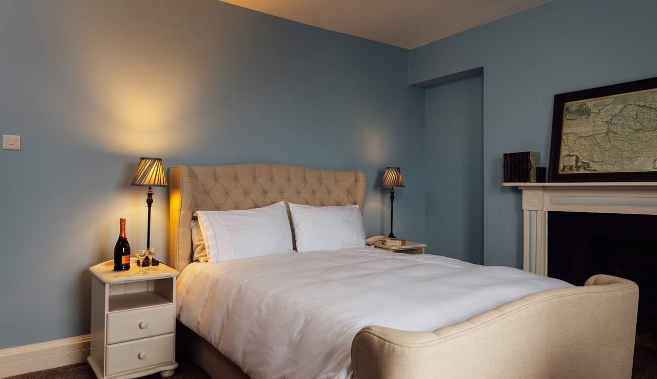 Ornate original fireplaces adorn the three bedrooms. 
