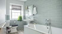 Airy family bathroom on the first floor with a sea view. 
