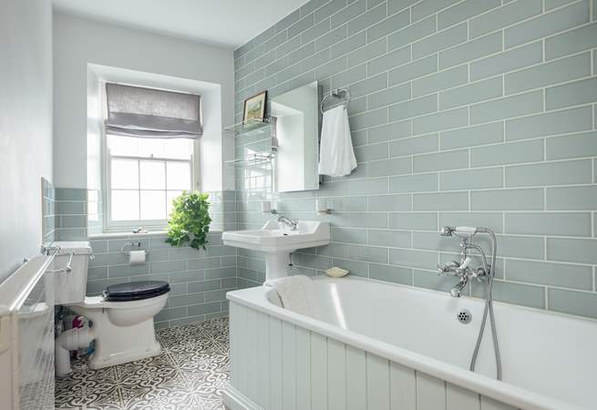 Airy family bathroom on the first floor with a sea view. 