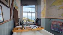 Soak in the bath and take in the views from the ground floor bathroom. 