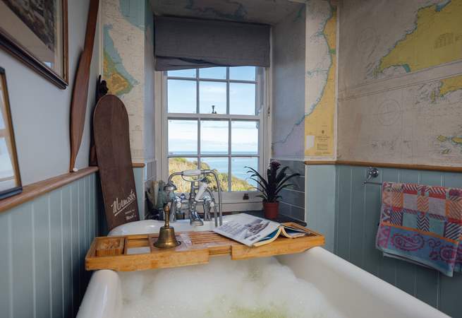 Soak in the bath and take in the views from the ground floor bathroom. 