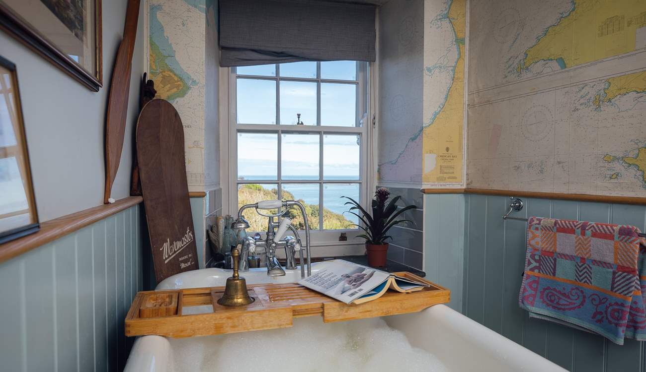 Soak in the bath and take in the views from the ground floor bathroom. 