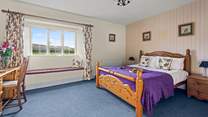 Bedroom 4 is another welcoming room with a king-size bed.