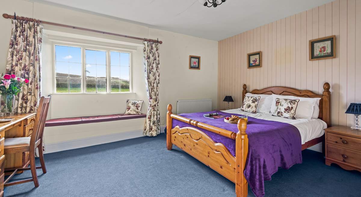 Bedroom 4 is another welcoming room with a king-size bed.