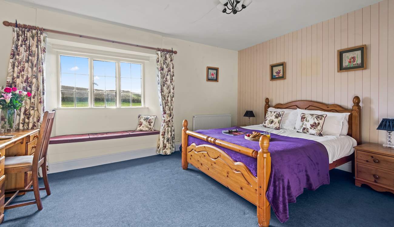 Bedroom 4 is another welcoming room with a king-size bed.