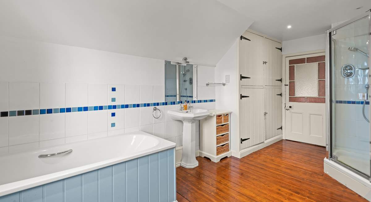 The family bathroom is fully equipped with bath tub and shower cubicle.