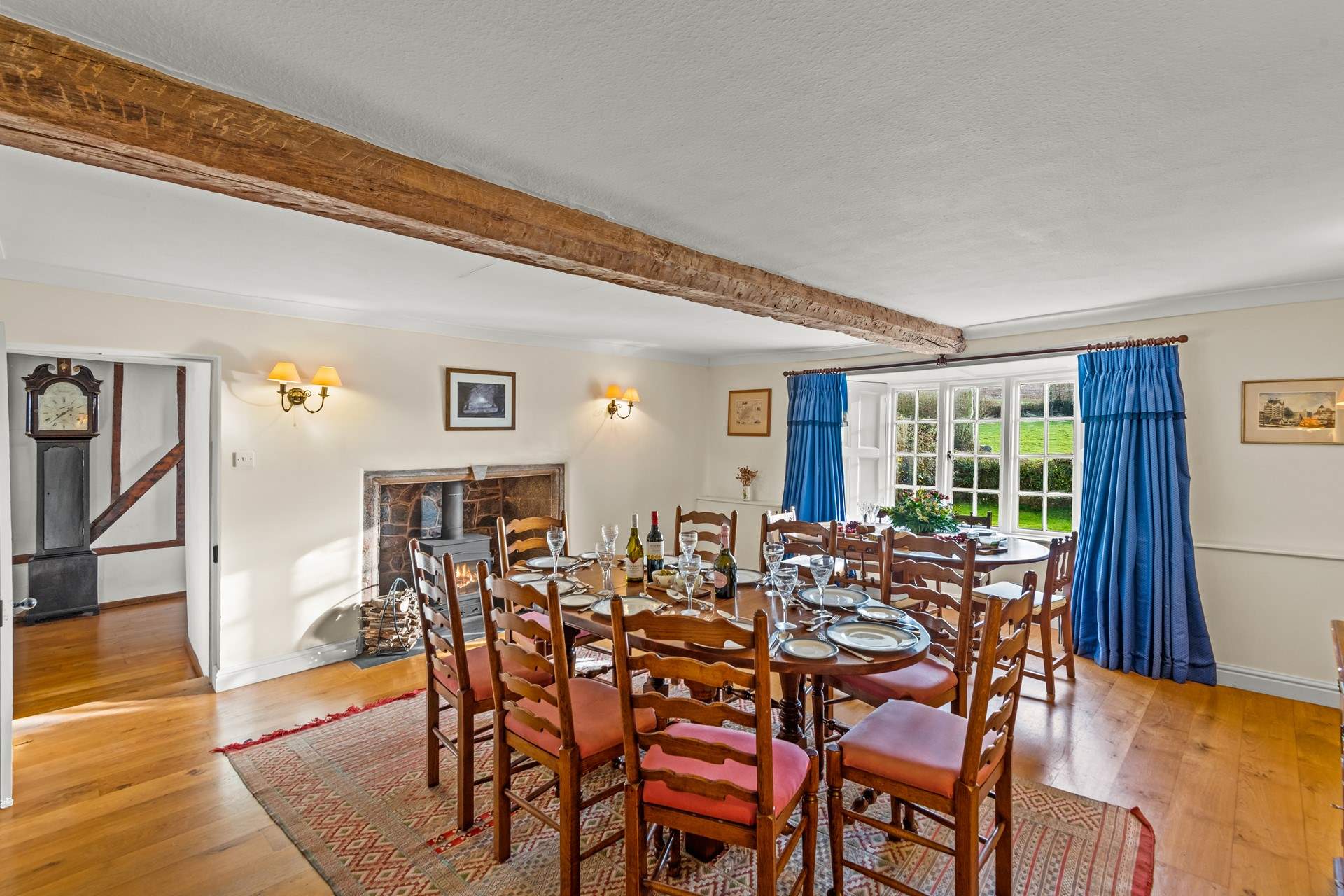 The beautiful rounded tables provide a very sociable feel to the dining arrangements. The dining-room leads into the hallway and to the second larger sitting-room.