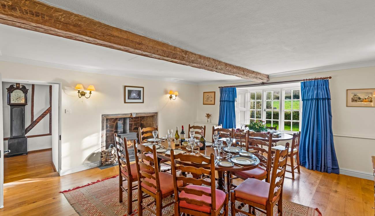 The beautiful rounded tables provide a very sociable feel to the dining arrangements. The dining-room leads into the hallway and to the second larger sitting-room.