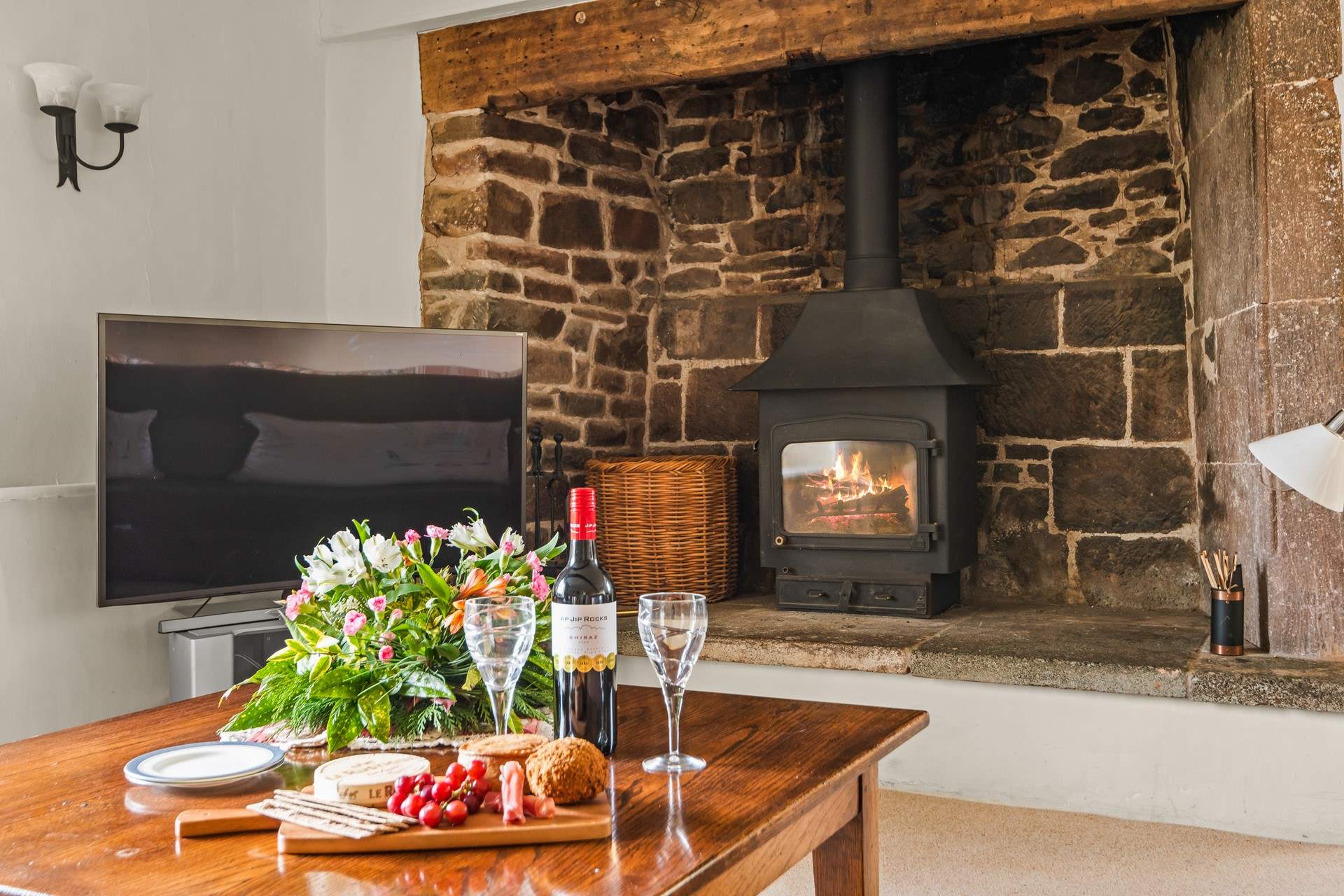 One of the many wood-burners which really brings this characterful building to life.