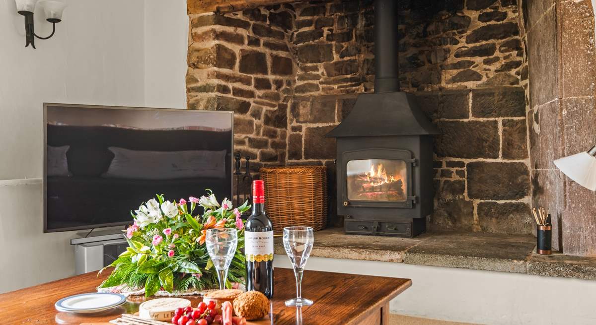 One of the many wood-burners which really brings this characterful building to life.