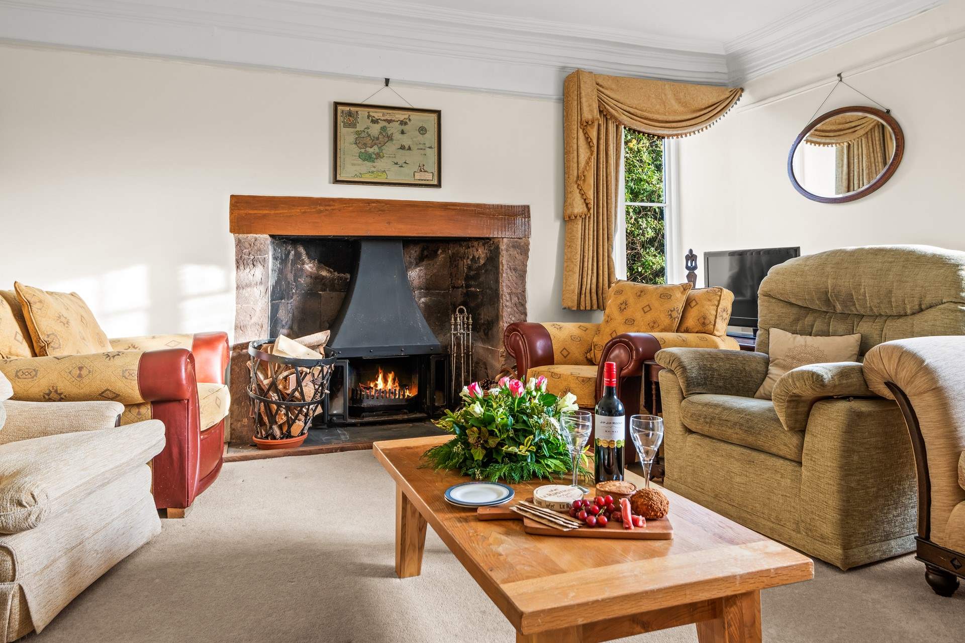 Another cosy sitting-room fully furnished with a magnificent wood-burner.