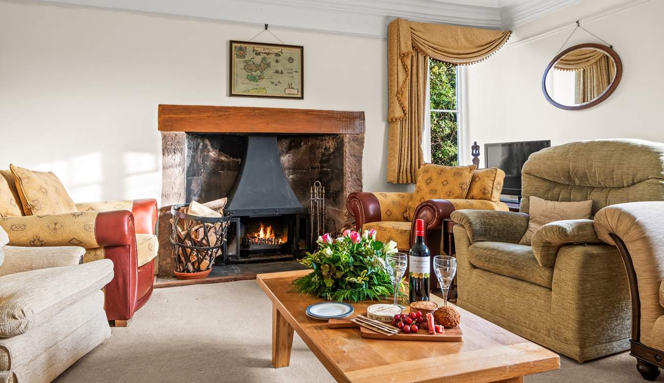 Another cosy sitting-room fully furnished with a magnificent wood-burner.
