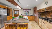 The kitchen leads into the conservatory and the very handy utility-room beyond.