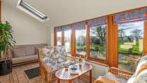Plentiful seating in the super bright and airy conservatory.
