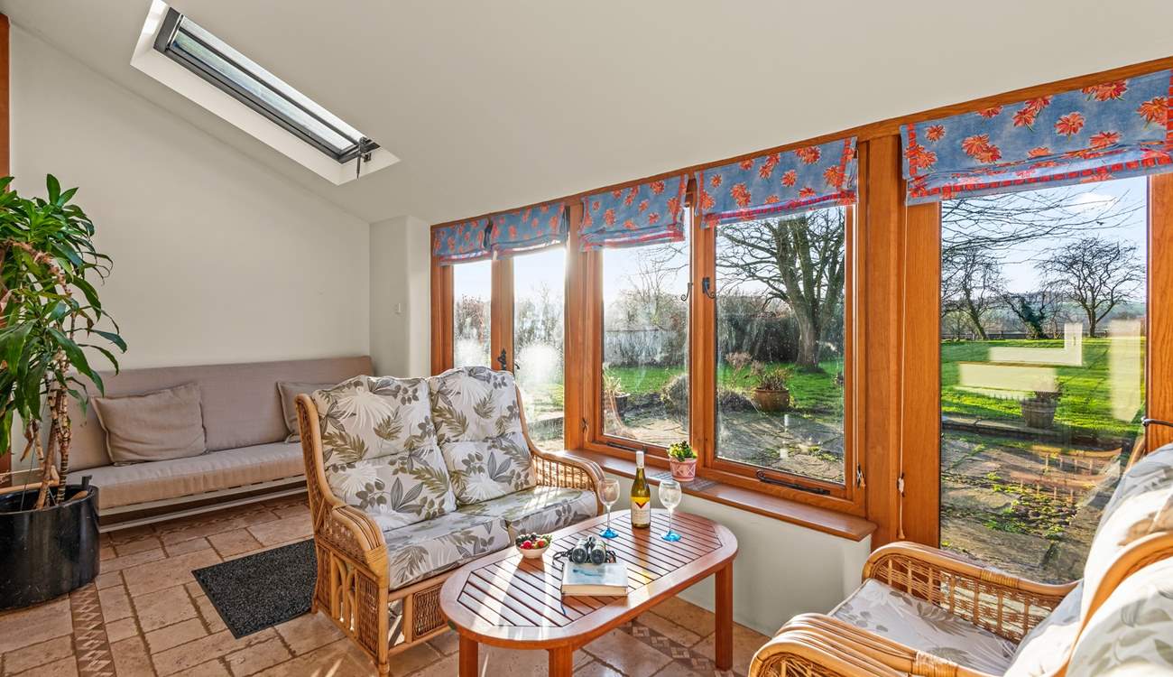 Plentiful seating in the super bright and airy conservatory.