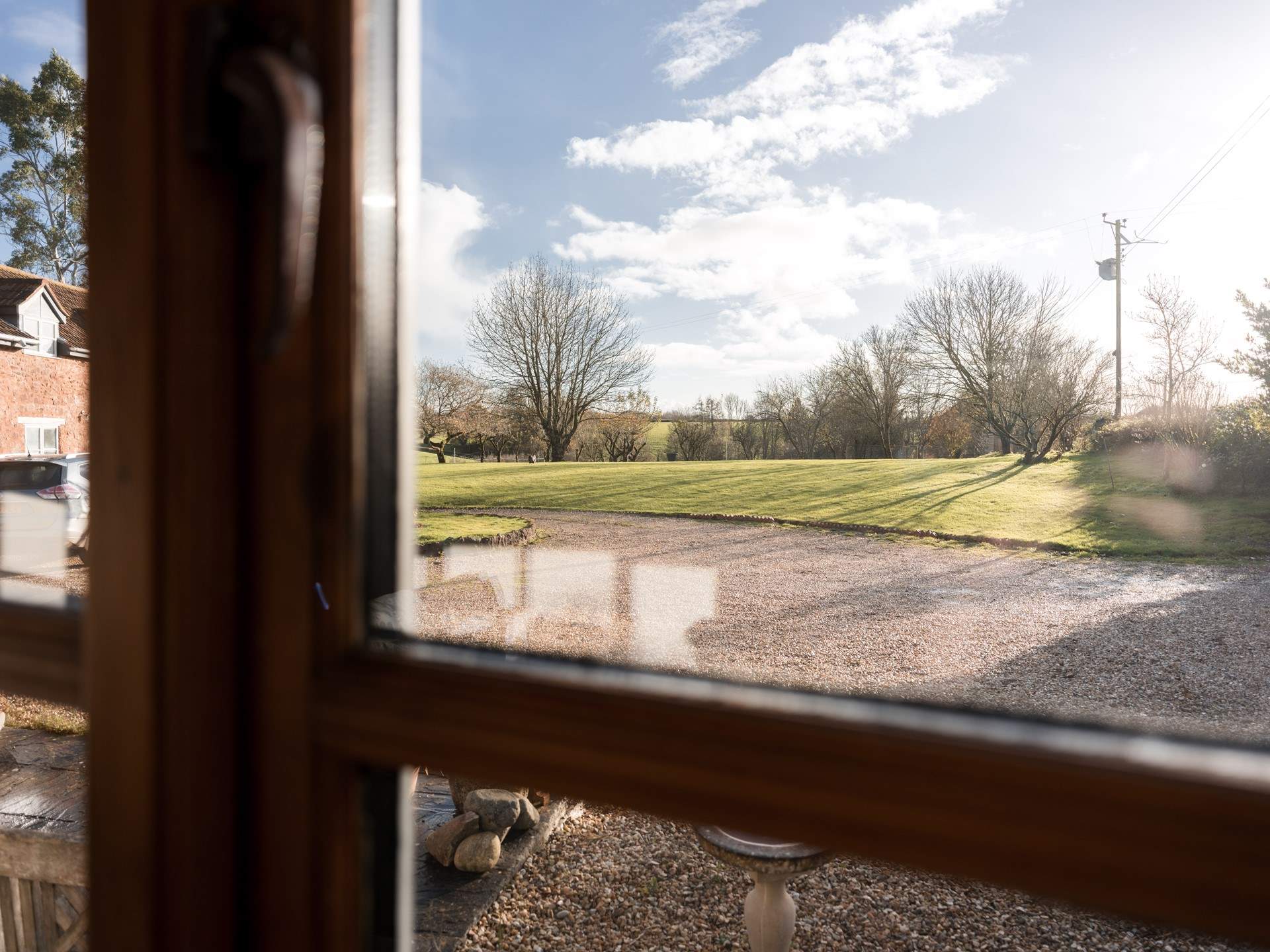 Views out from the sitting-room over the sweeping lawns of the main house.