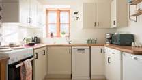 The ergonomic kitchen is well-equipped with lots of preparation space and all the mod-cons you would expect from such a lovely home-from-home.