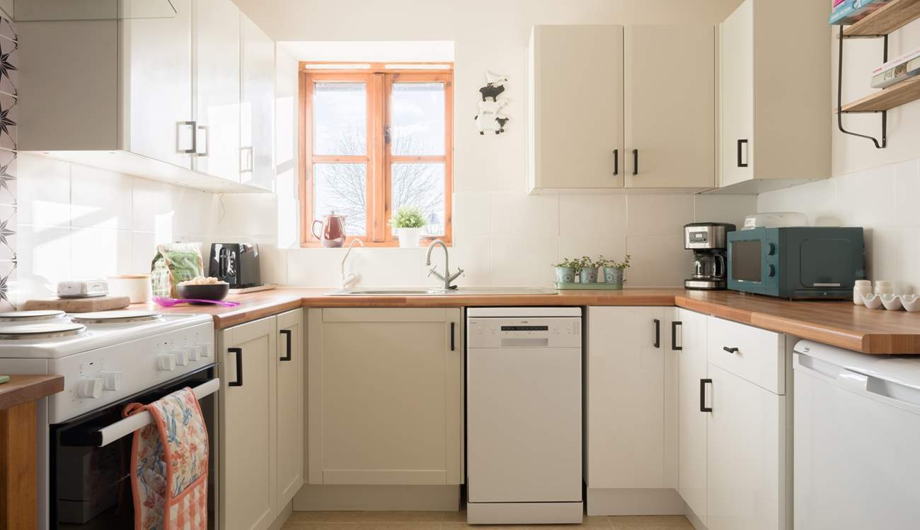 The ergonomic kitchen is well-equipped with lots of preparation space and all the mod-cons you would expect from such a lovely home-from-home.