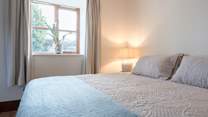 The primary bedroom is such a haven of calm and quiet with a very tempting super-king size bed (can be split into two singles). Late starts may be likely!