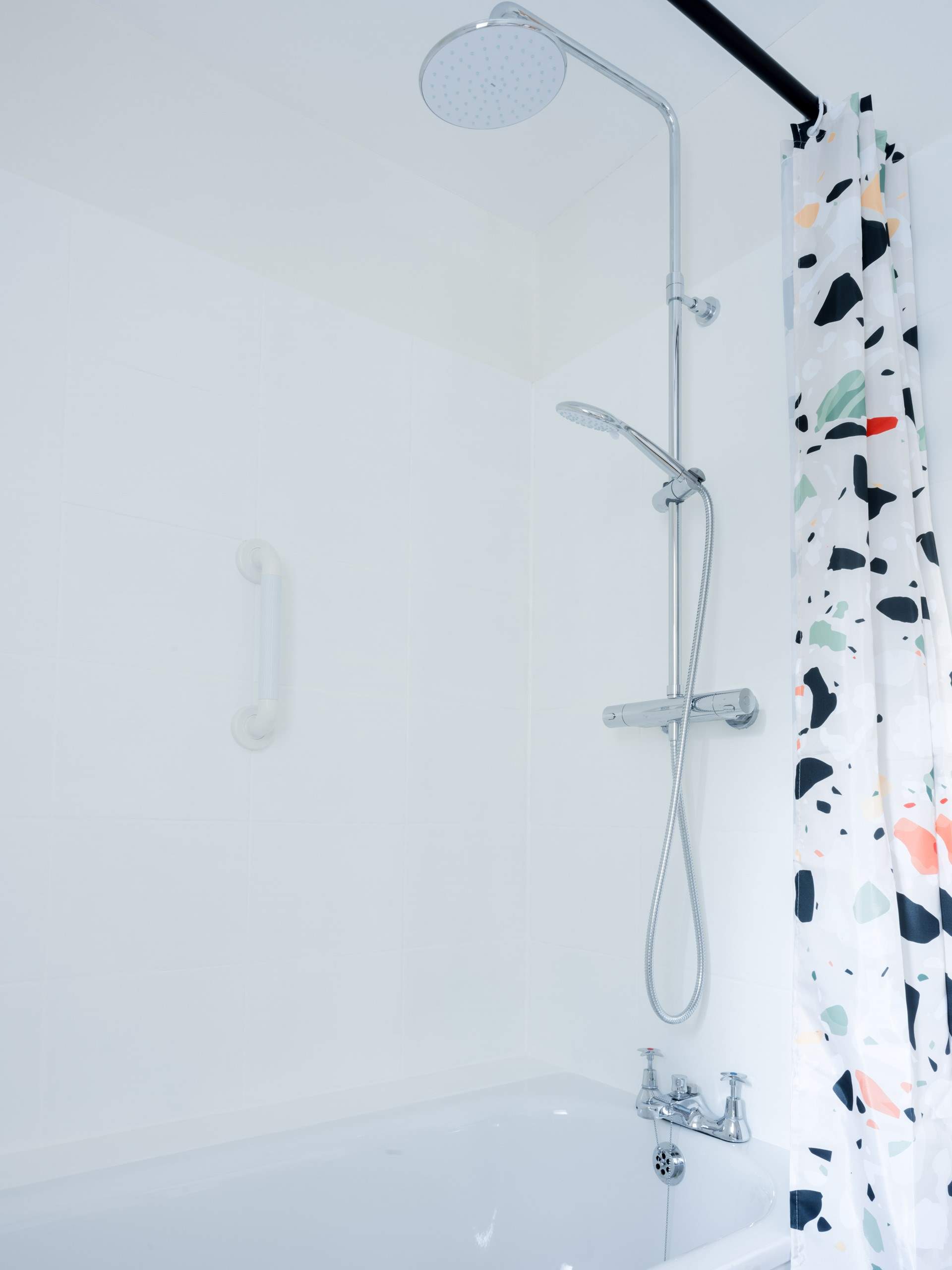 A wonderful rainfall shower and deep bath await to ease any achy legs after a day exploring.