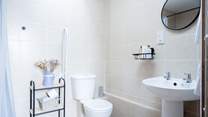 The main shower-room is very accessible with a large wet-room shower enclosure. The skylight lets the natural light pour in.