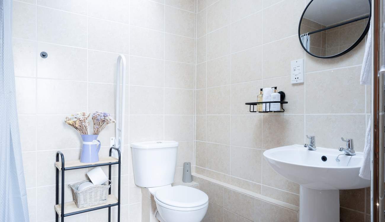 The main shower-room is very accessible with a large wet-room shower enclosure. The skylight lets the natural light pour in.