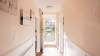 The central hallway links all the rooms together.
