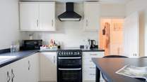The kitchen sits to the back of the house overlooking the back garden.