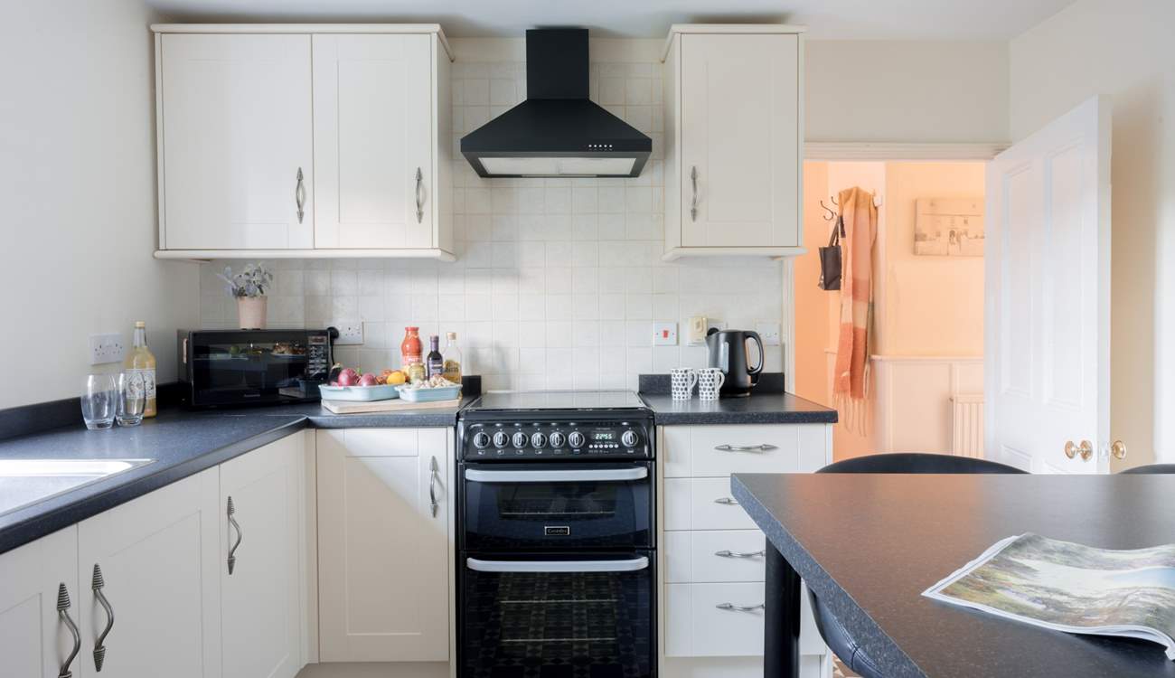 The kitchen sits to the back of the house overlooking the back garden.