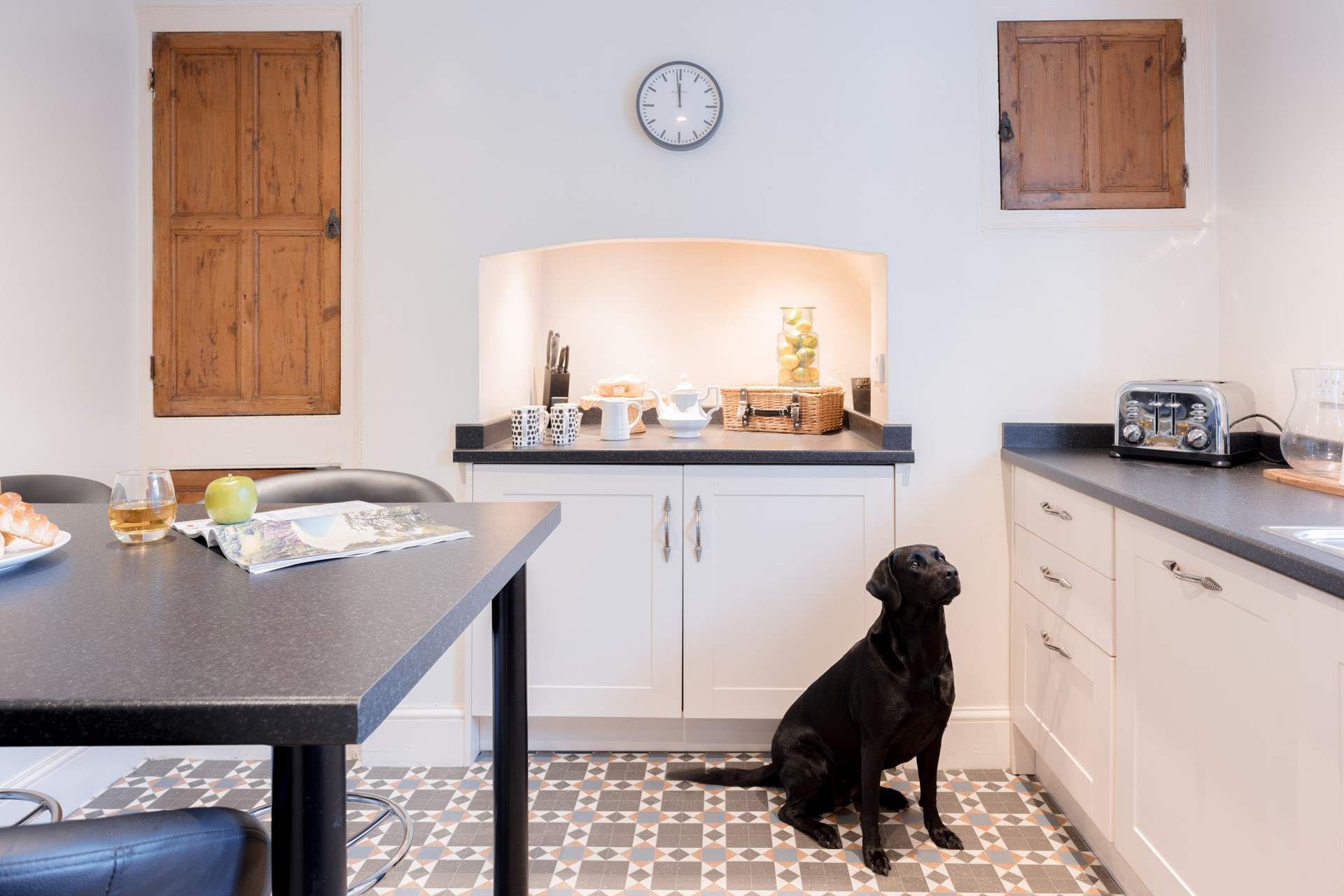 Head down the hallway where you will find the kitchen.