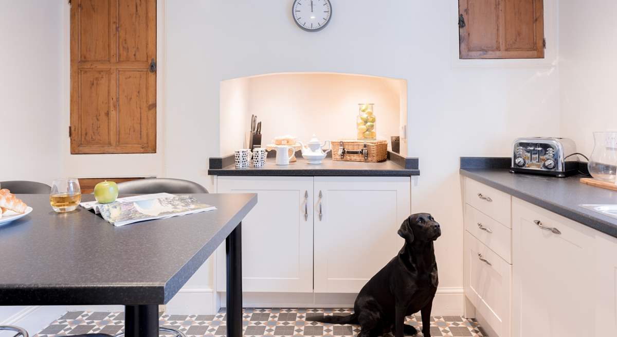 Head down the hallway where you will find the kitchen.