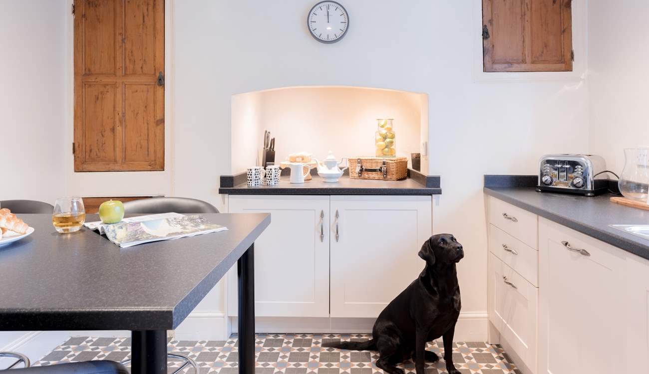 Head down the hallway where you will find the kitchen.