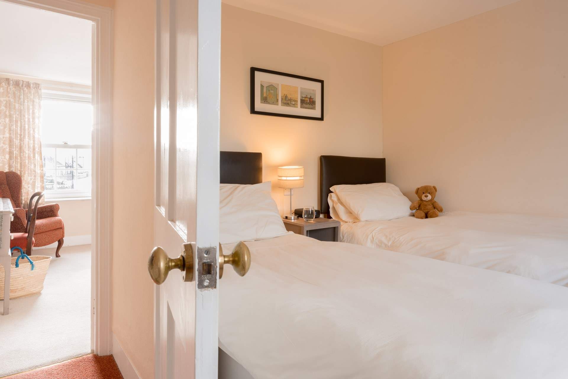 Across the landing you will discover the twin bedroom with sea views.
