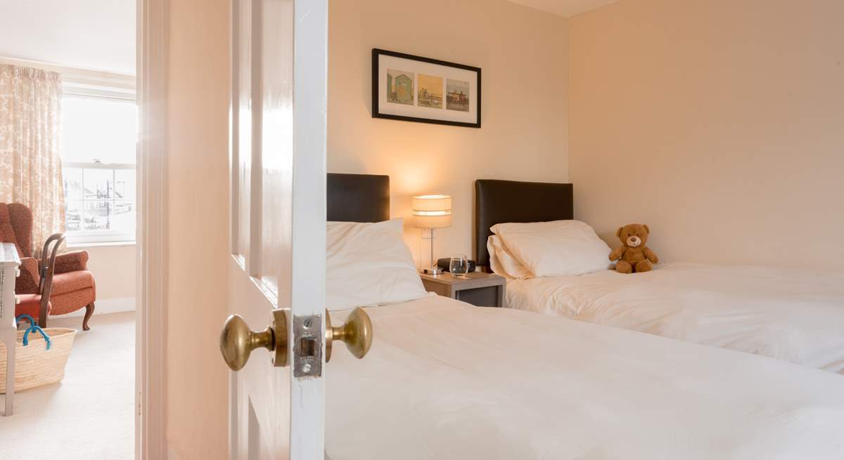Across the landing you will discover the twin bedroom with sea views.