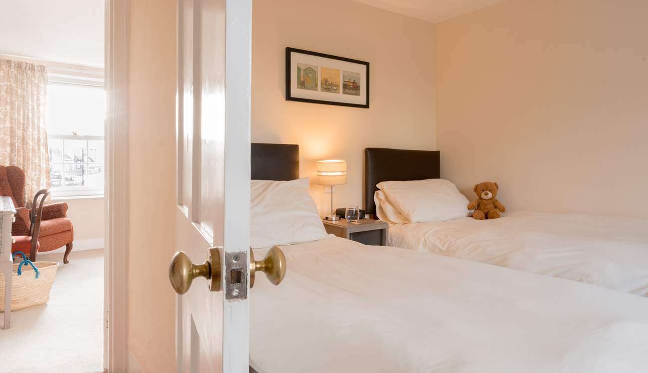 Across the landing you will discover the twin bedroom with sea views.