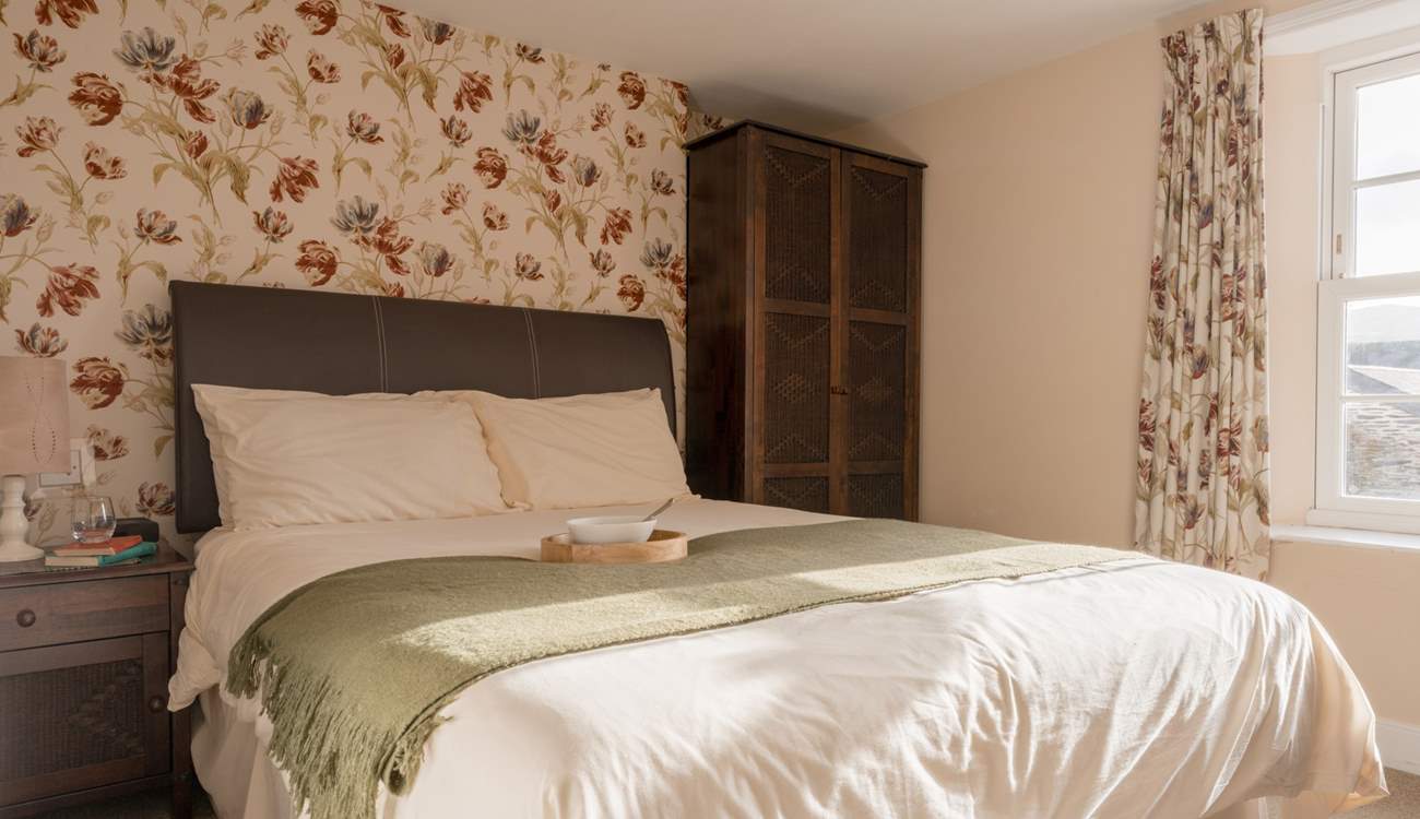 The en suite bedroom looks out over the village.