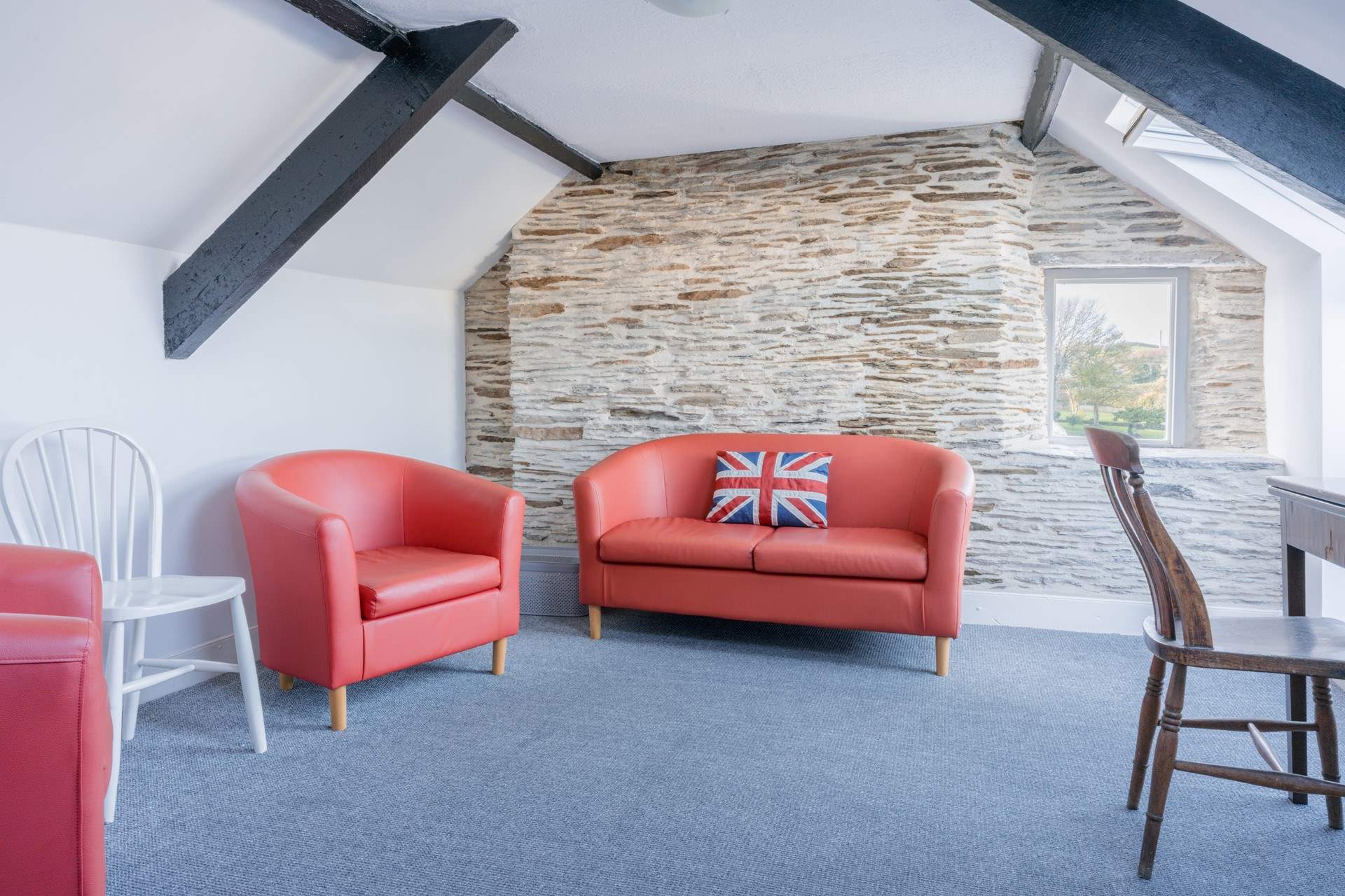 This room provides the perfect spot for a quiet read or catch up on some work.