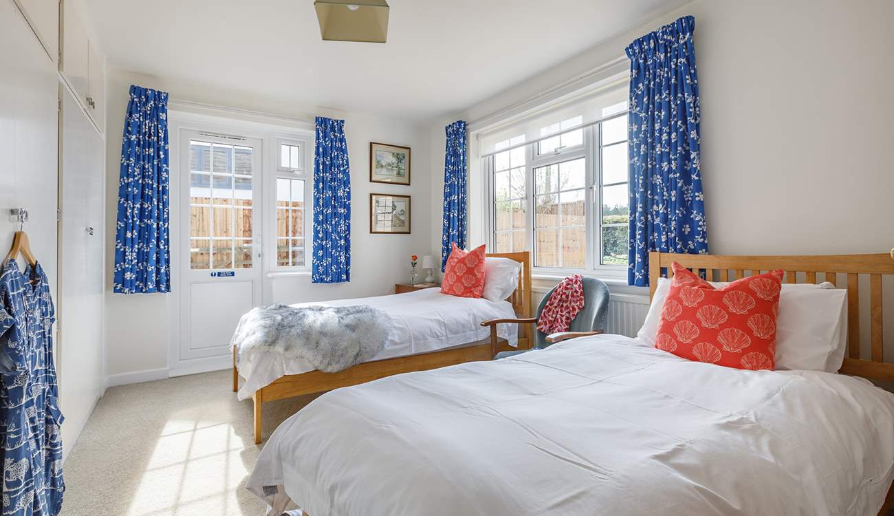 The light-filled, dual-aspect twin bedroom. 