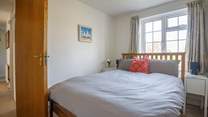 The double bedroom has ample storage so unpack your suitcases and unwind fully.
