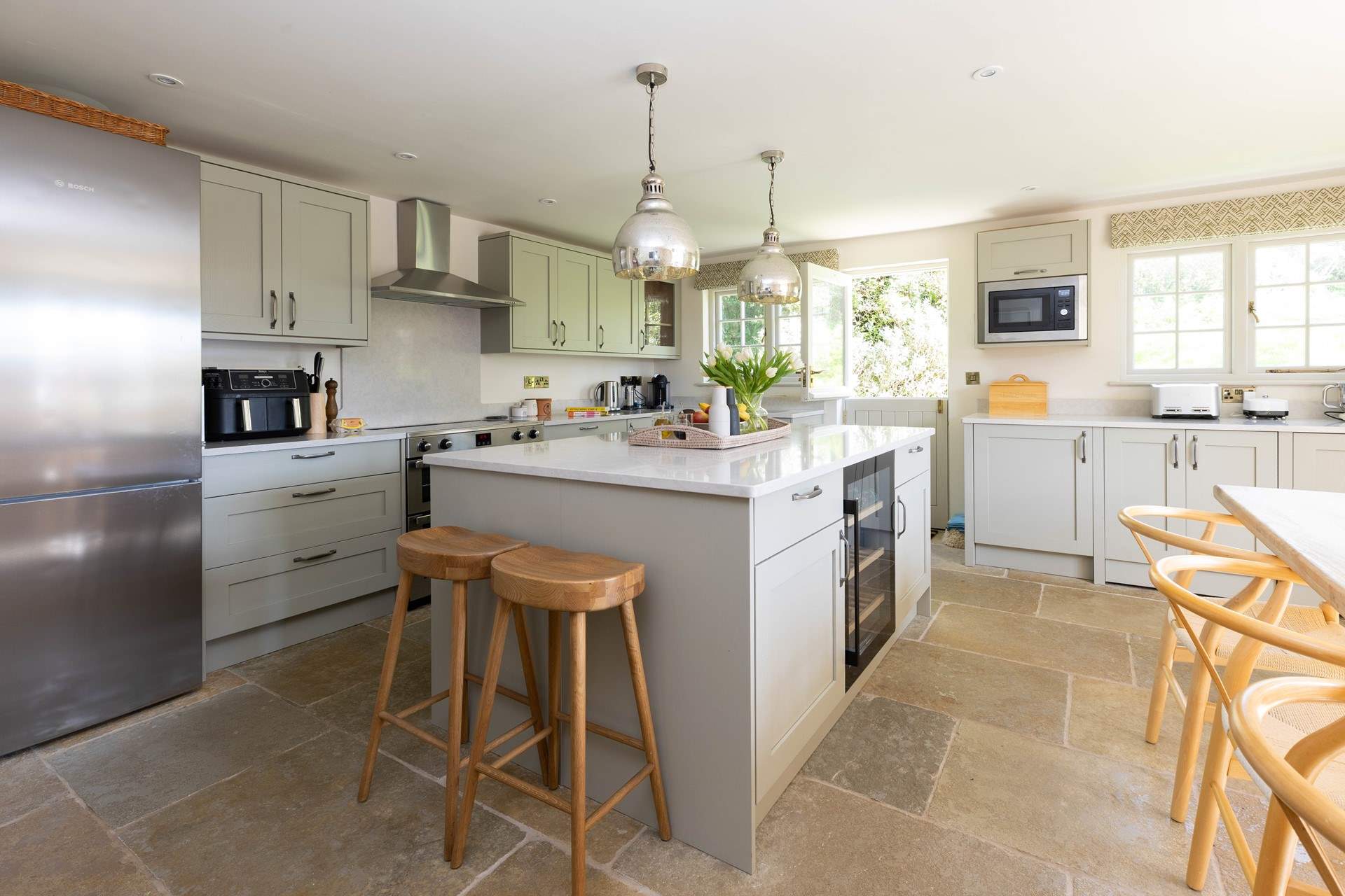 The well-equipped kitchen has the essential wine fridge and air fryer too. 