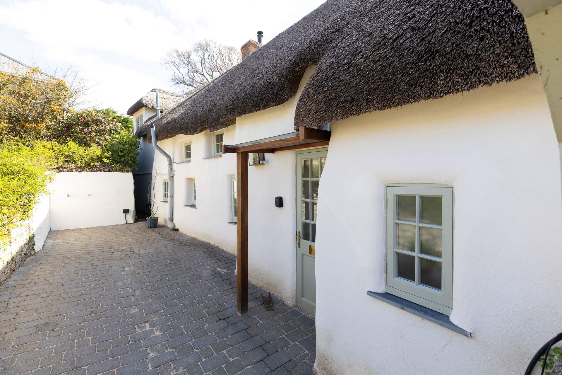 The back of the farmhouse catches the last of the afternoon sun. 