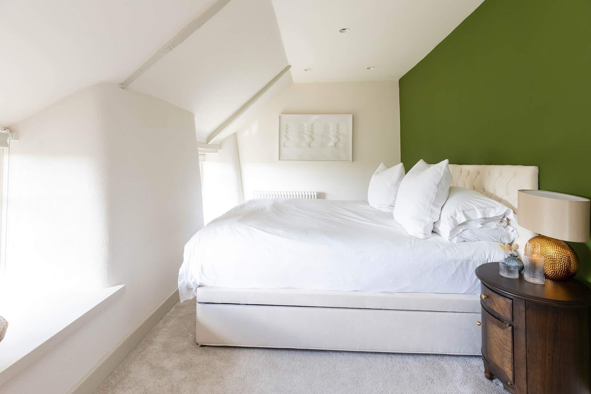 The bed is perfectly positioned to enjoy the view. 