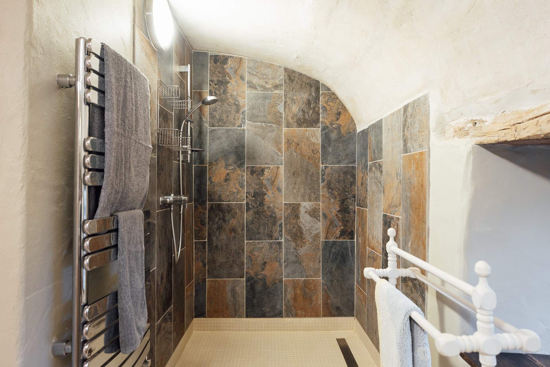 The luxurious walk-in shower is extremely spacious. 