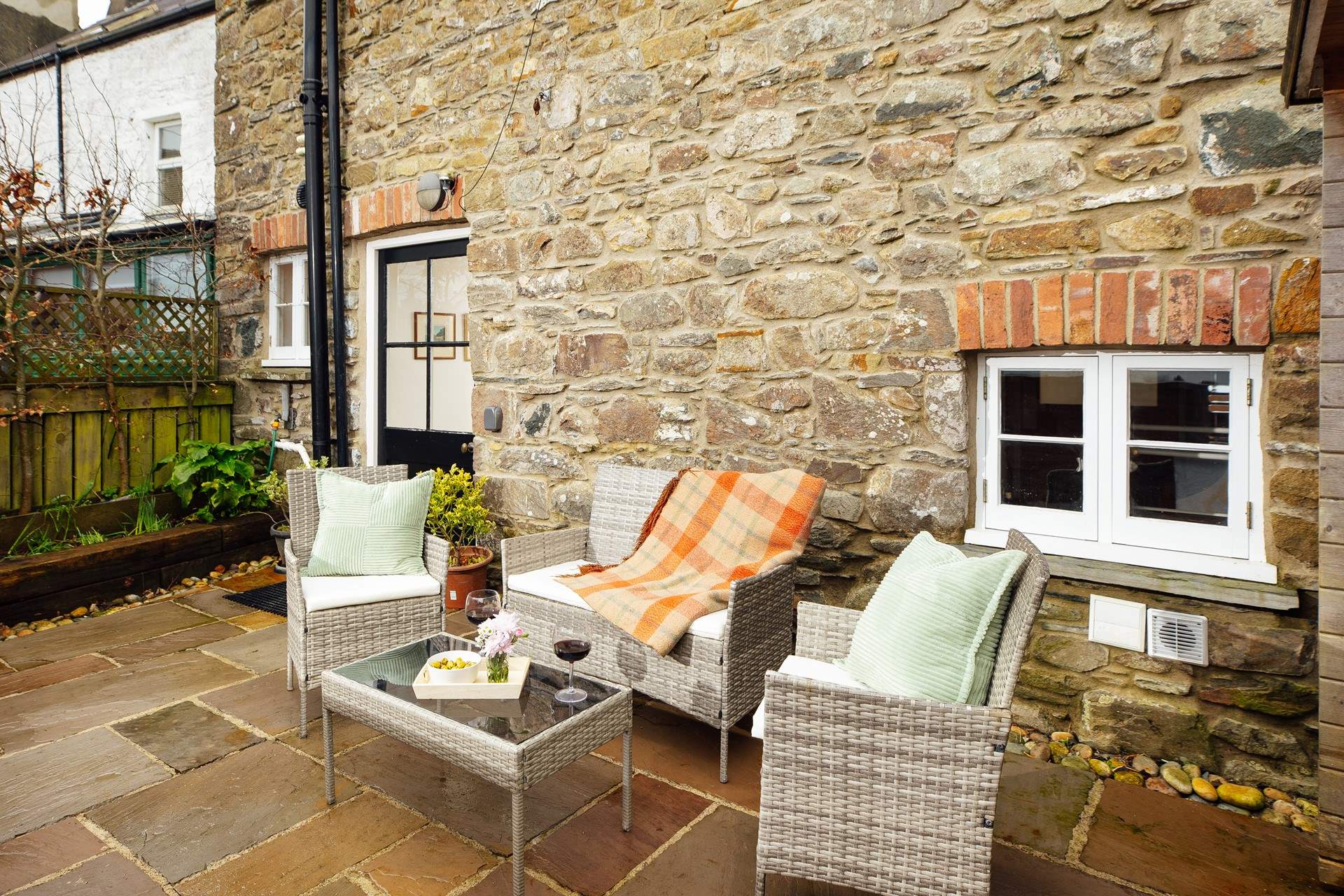 The enclosed patio is ideal for taking time out with a good book. The dog will love it here too. 