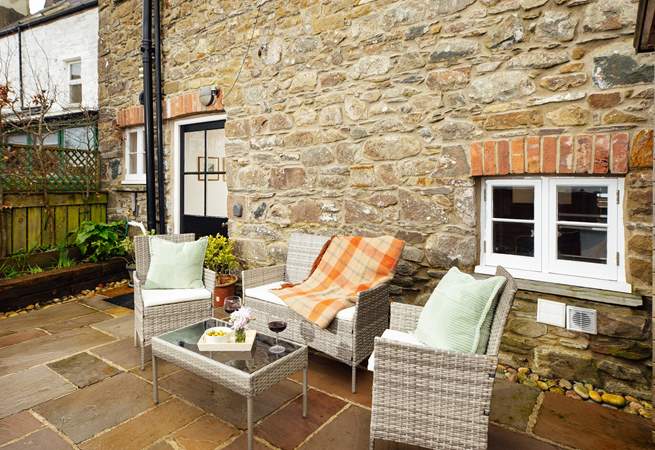 The enclosed patio is ideal for taking time out with a good book. The dog will love it here too. 