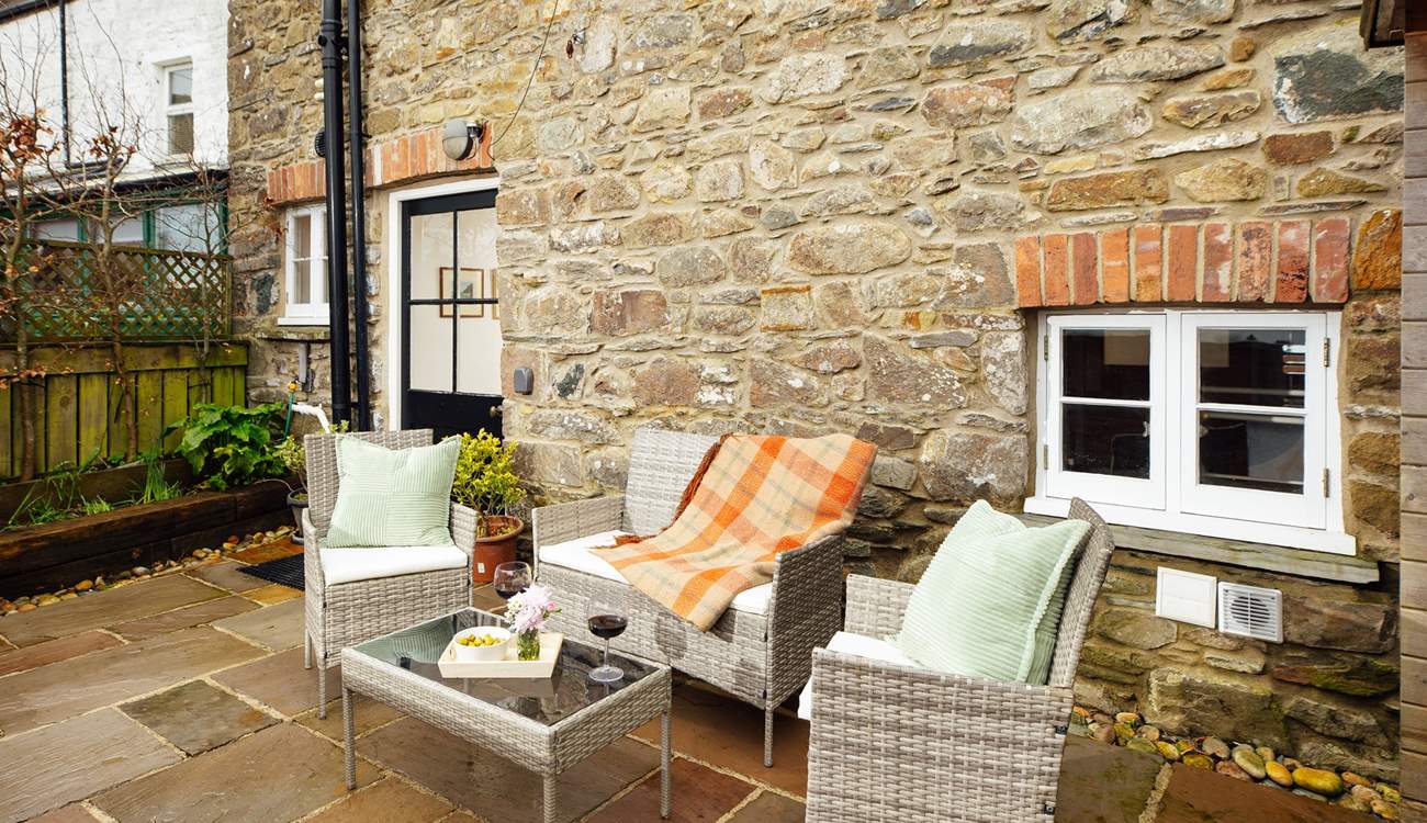 The enclosed patio is ideal for taking time out with a good book. The dog will love it here too. 