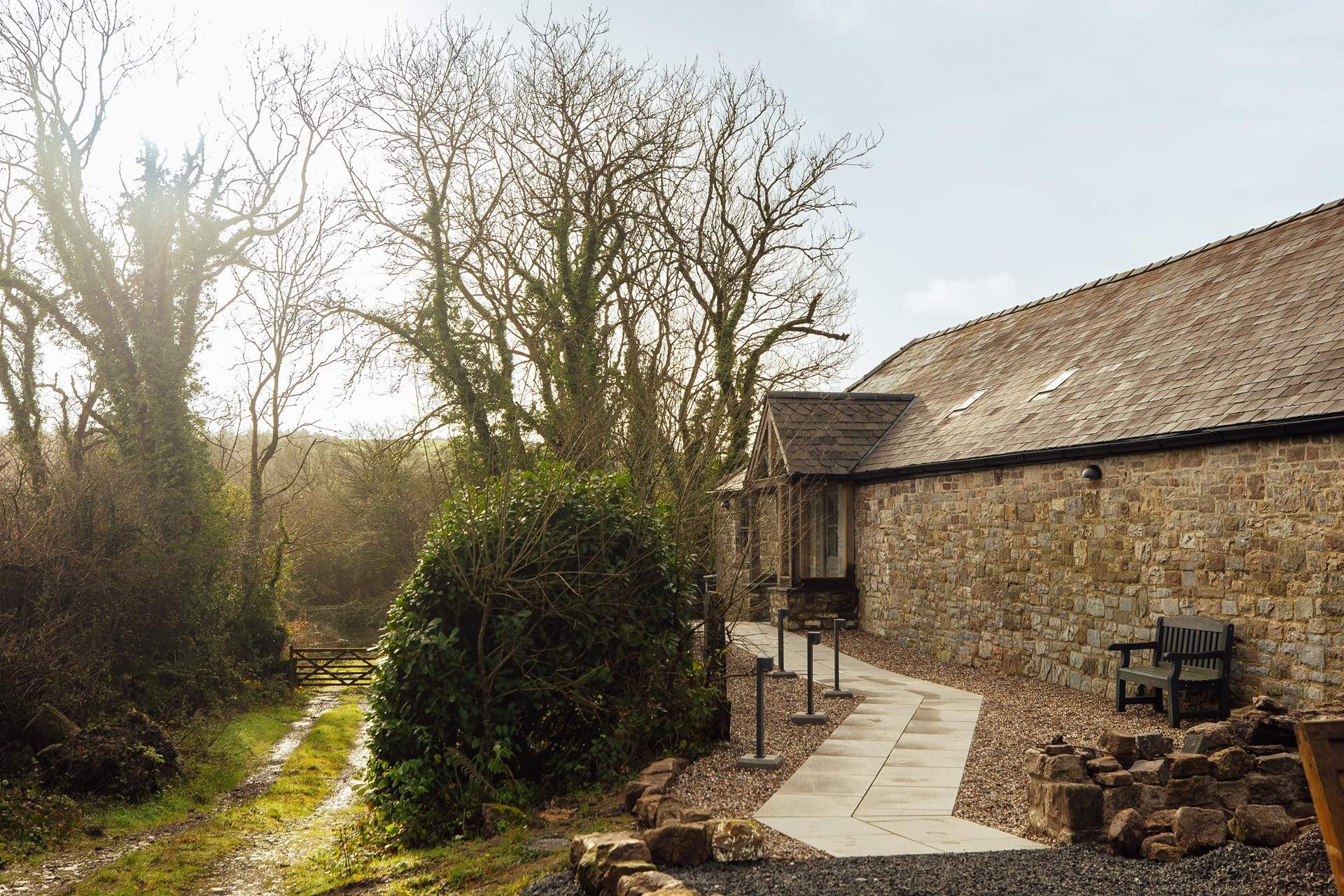 East Cottage nestles in its very own private corner, surrounded by pretty woodland and rolling meadows. Look out for  the sheep grazing across the way.  