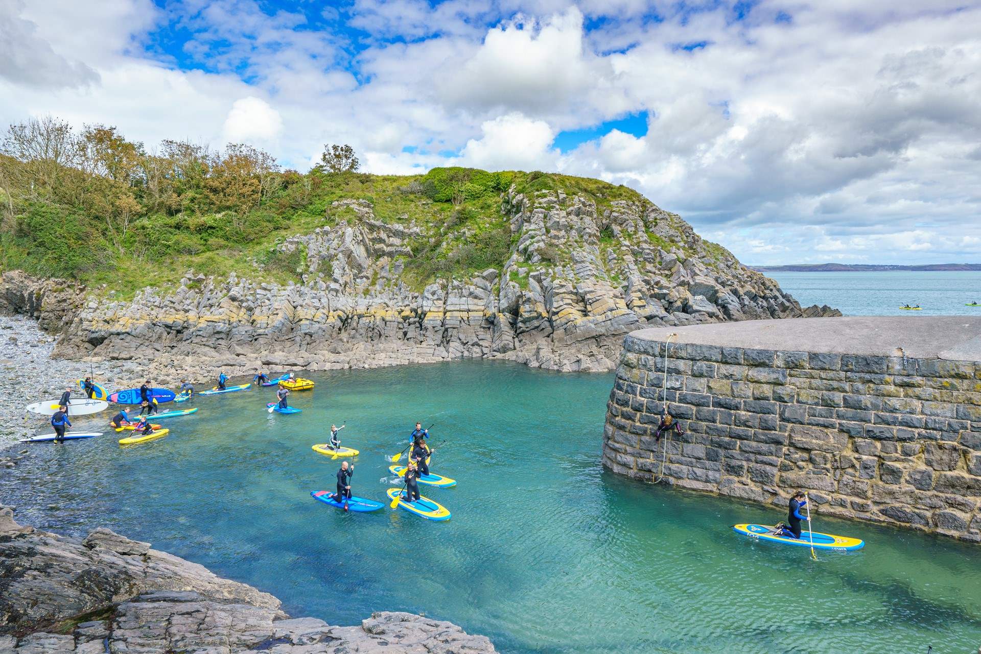 Try paddleboarding at Stackpole. 